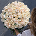 75 white roses in a round bouquet, viewed from above
