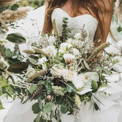Summer bridal bouquet of white flowers and greenery