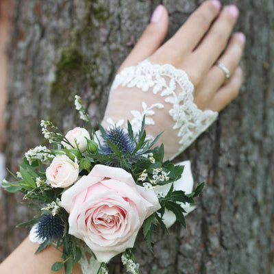 Pink rose wrist corsage with greenery