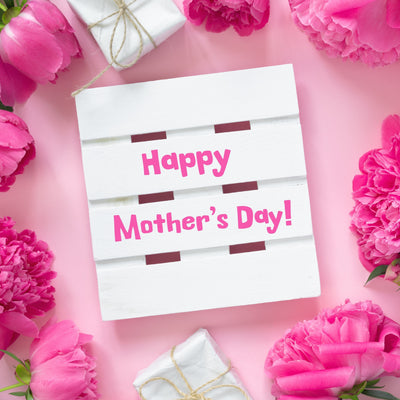 Pink carnations surrounding a Happy Mother's Day sign
