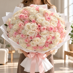 Bouquet of 150 white and pink roses in white wrapping with a pink ribbon