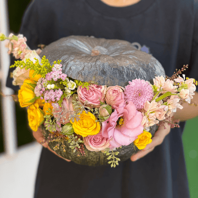 Pink and Yellow Flowers in a Pumpkin - ART Flowers LA